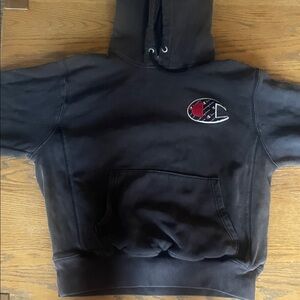 Champion Dark Hoodie with Iconic Emblem